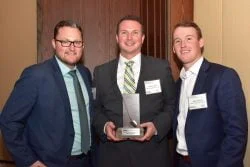 Mike McGarragan, Shawn Jordan and Jesse Langlois accepting the 2016 Reinvest Brownie Award on behalf of Walker Environmental.