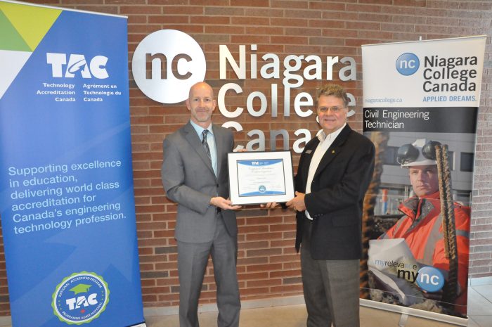 TAC Executive Director Richard Stamper presents the TAC national program accreditation certificate to Gilles Laroche, Program Coordinator, Civil Engineering Technician at Niagara College.