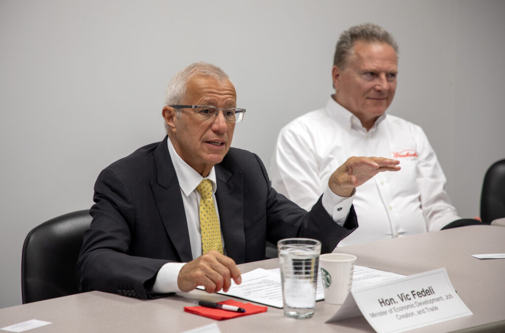 The Honourable Vic Fedeli (at left) speaks at a GNCC roundtable