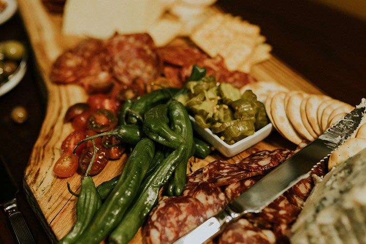 A variety of foods including delicious charcuterie are available.