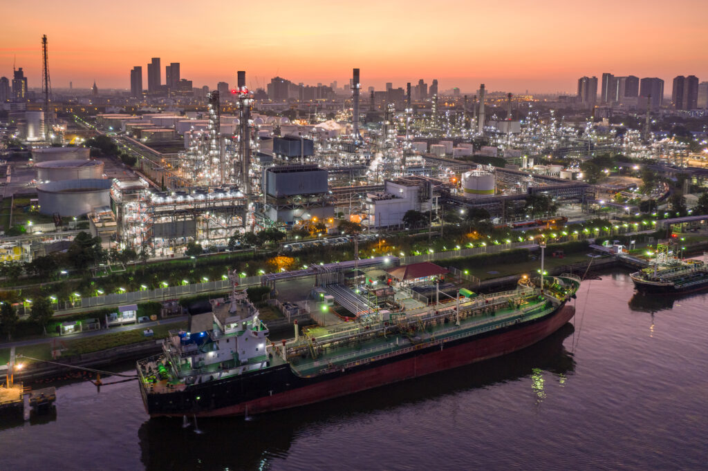 A tanker docks at an oil refinery