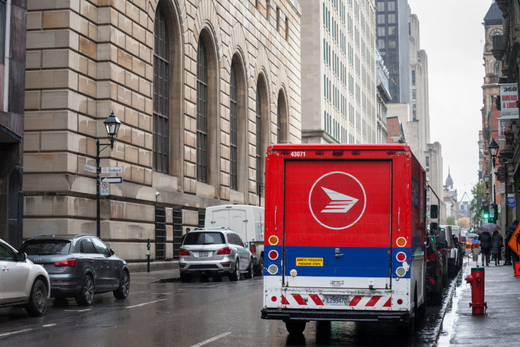 A Canada Post delivery truck on a street in Montreal, Quebec.