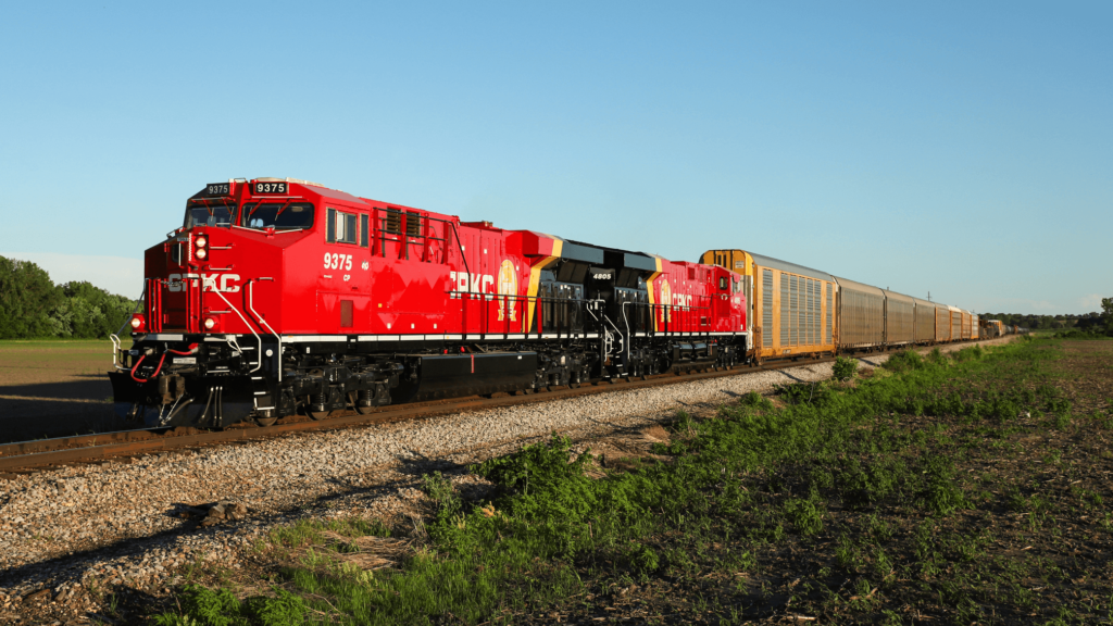 A CKPC locomotive pulls a freight train