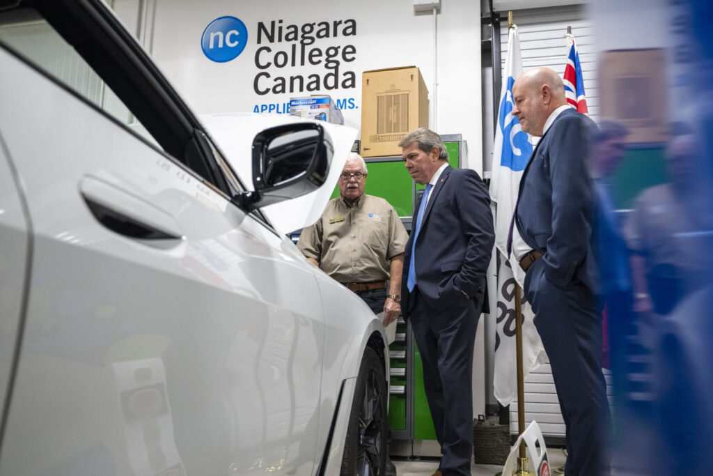 Coordinator of NC’s Motive Power program, Wayne Toth, MP Vance Badawey, and NC President Sean Kennedy tour Niagara College's Green Automotive Technology Lab at the Welland Campus