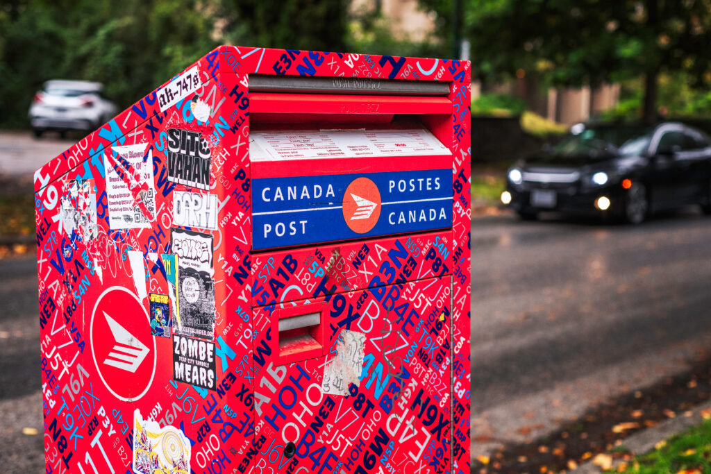 A Canada Post mailbox on a street in Vancouver, British Columbia