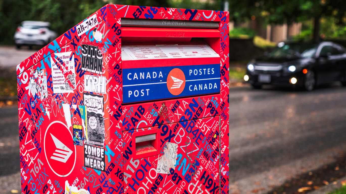 A Canada Post mailbox on a street in Vancouver, British Columbia