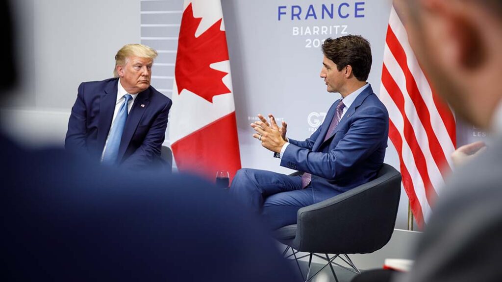 U.S. President Donald Trump, at left, listens while Canadian Prime Minister Justin Trudeau speaks, at right