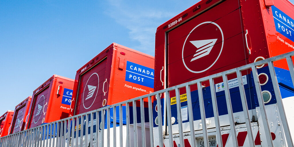 Canada Post vehicles parked outside a sorting facility on May 16, 2010, Toronto, Ontario Canada