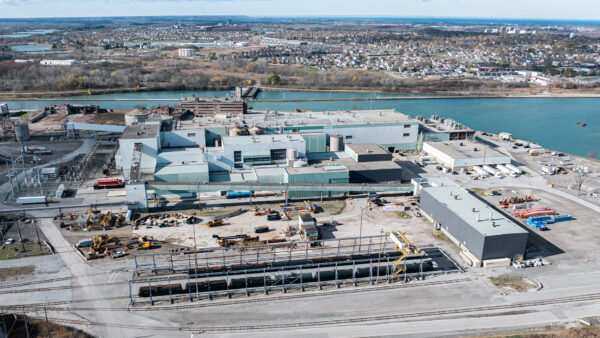 An aerial view of Savage Niagara Transload at Thorold Multimodal Hub. A large industrial logistics complex next to a waterway.