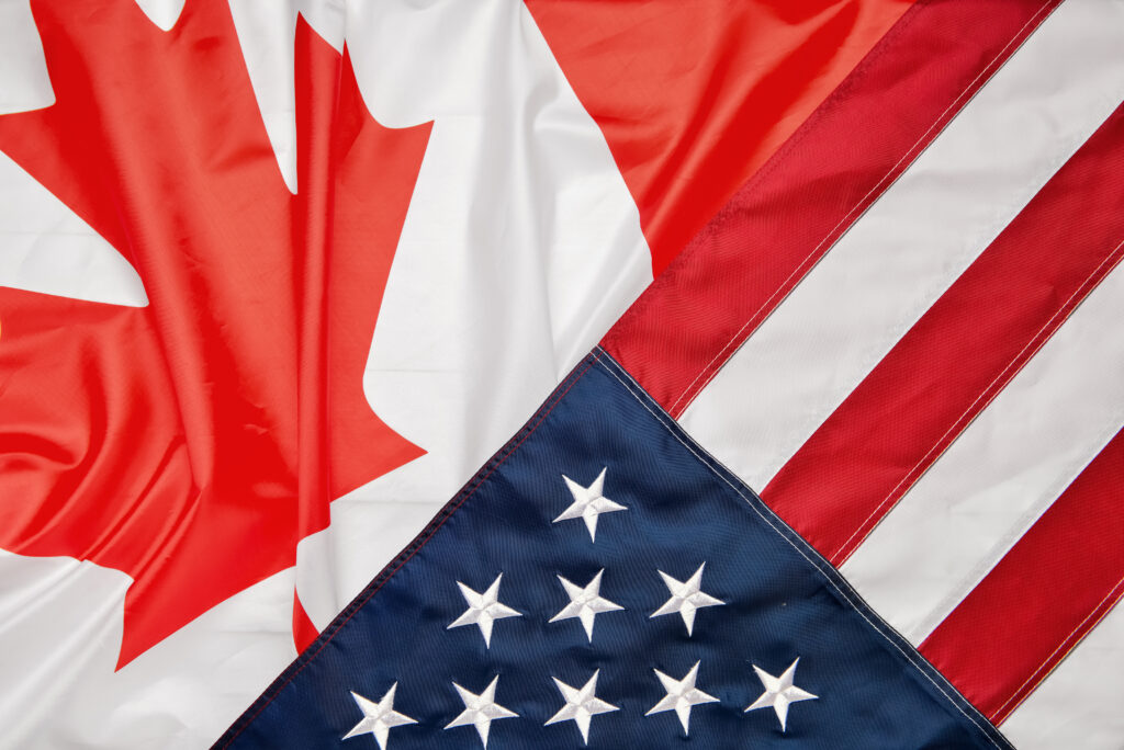 The U.S. and Canadian flags juxtaposed